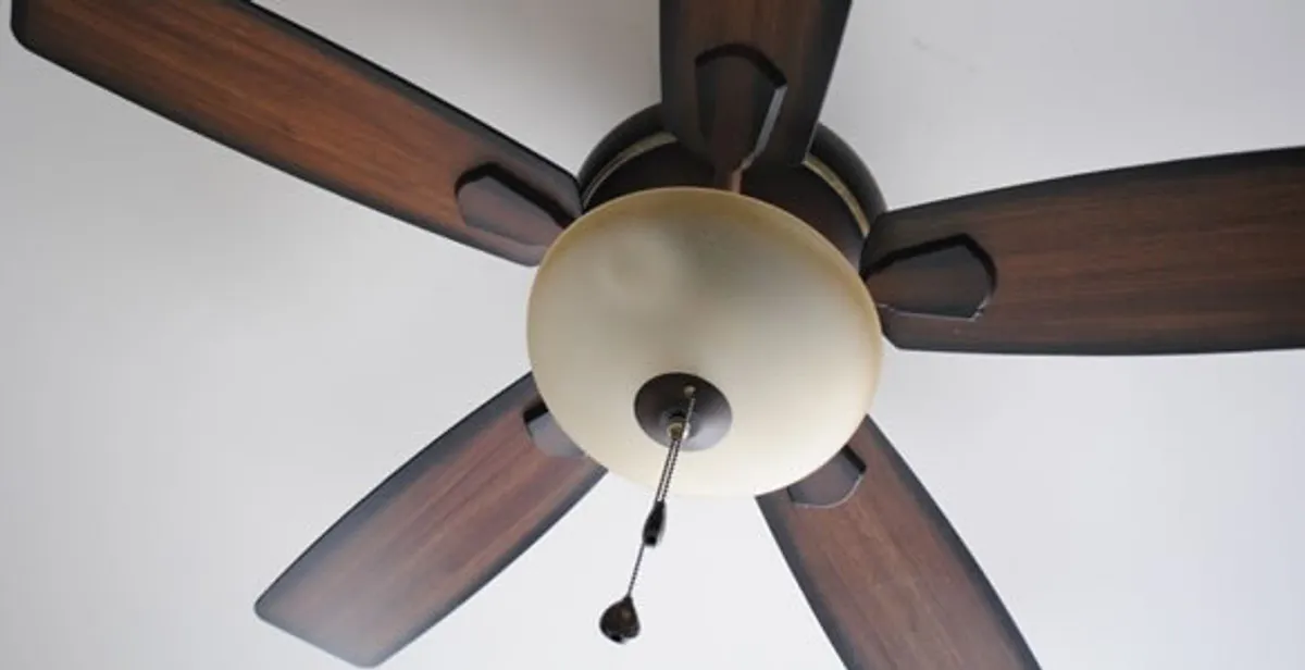 Fully installed ceiling fan with balanced blades and light fixture in Stockton, CA