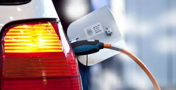 Electric car plugged into EV charger after professional installation in Stockton, CA