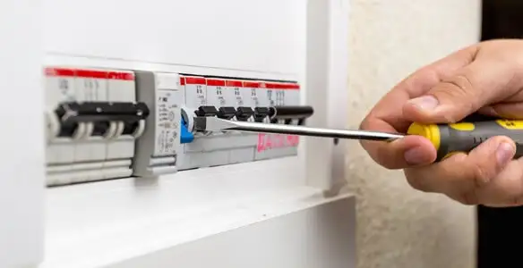 electrical panel upgrade service showing technician adjusting circuit breakers during system upgrade in Stockton, CA