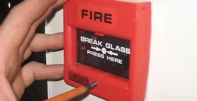 fire alarm installation service showing manual fire alarm pull station installed by licensed electricians in Stockton, CA