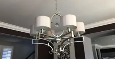 Modern chandelier installation with multiple light fixtures in Stockton, CA