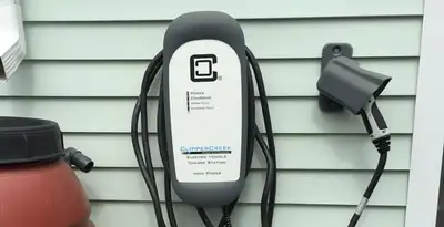 Outdoor electric vehicle charger installation on residential wall in Stockton, CA