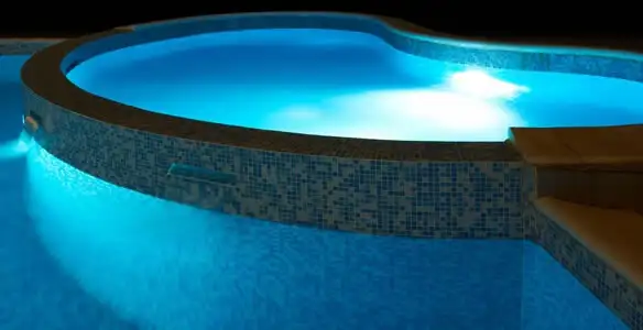 pool light installation and repair services highlighting illuminated pool interior lighting in Stockton, CA
