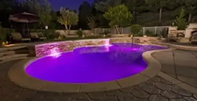 pool light installation and repair services illuminating a residential swimming pool in Stockton, CA