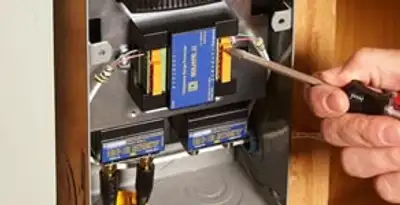 Whole home surge protection device being installed by a licensed electrician to protect electrical systems in Stockton, CA